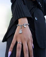 Load image into Gallery viewer, Teddy bear bracelets.   Minimalist bracelets featuring teddy bear pendants. Elevate your style with minimalist bracelets, perfect for daily wear and layering. Crafted from high-quality titanium and available in silver color.  Material: Titanium, 21.3cm in length.   | water-resistant, no-tarnishing, hypoallergenic |
