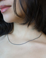 Load image into Gallery viewer, The best daily chain.  Minimalist necklace featuring delicately designed snake chain. Elevate your style with our necklace, perfect for daily wear and layering. Crafted from high-quality titanium and available in silver color.   Material: Titanium, Color: Silver. 45cm in length.  | water-resistant, no-tarnishing, hypoallergenic |
