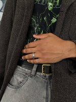 Load image into Gallery viewer, Open ring resembling the silhouette of waves.  Irregular texture of the surface inspired by the bold silhouette of a wave crashing. Elevate your style with our minimalist ring, perfect for daily wear and layering. Crafted from high-quality titanium and available in silver color.  Material: Titanium  | water-resistant, no-tarnishing, hypoallergenic |
