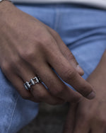 Load image into Gallery viewer, Simple but Bold.  Delicately designed bike chain ring. It does not limit its shape to a circle but swivels around as it moves. Elevate your style with our minimalist ring, perfect for daily wear and layering.  Crafted from high-quality titanium and available in silver color.  Material: Titanium.  | water-resistant, no-tarnishing, hypoallergenic
