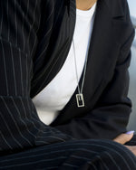 Load image into Gallery viewer, Two rectangles in the same ratio.   Minimalist necklace featuring delicately designed two rectangular pendants. Elevate your style with our necklace, perfect for daily wear and layering.  Crafted from high-quality titanium and available in silver color.  Material: Titanium, 63+5cm in length. | water-resistant, no-tarnishing, hypoallergenic |
