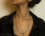 Load image into Gallery viewer, A simple Cuban chain.   Minimalist necklace featuring a mini-Cuban chain. Elevate your style with our necklace, perfect for daily wear and layering. Crafted from faux pearls and available in silver color  Material: Surgical steel, 59cm in length. | water-resistant, no-tarnishing, hypoallergenic |
