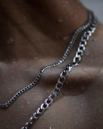 Load image into Gallery viewer, Simple 7mm Cuban chain/  Minimalist necklace featuring Cuban chain. Elevate your style with our necklace, perfect for daily wear and layering. Crafted from high-quality stainless steel and available in silver color  Material: Surgical steel, Chain diameter: 7mm. 67cm in length.  | water-resistant, no-tarnishing, hypoallergenic |
