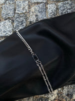 Load image into Gallery viewer,  Unique Black Pearl   Statement necklace featuring black stones and two different types of Cuban chains. Elevate your style with our necklace, perfect to highlight your outfit. Crafted from high-quality titanium and available in silver color  Materials: Titanium. 45+5cm in length.  | water-resistant, no-tarnishing, hypoallergenic |
