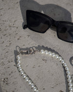 Load image into Gallery viewer, A simple pearl choker.  Minimalist pearl choker featuring a robust clasp. Elevate your style with our necklace, perfect for daily wear and layering. Crafted from faux pearls and available in silver color  Materials: Surgical steel, Faux pearls. 40cm in length. | water-resistant, no-tarnishing, hypoallergenic |
